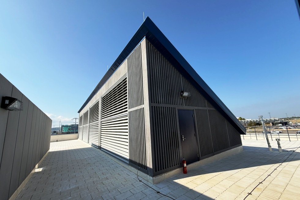 Generator clerestory combustion and cooling intake at roof with man door for service access.